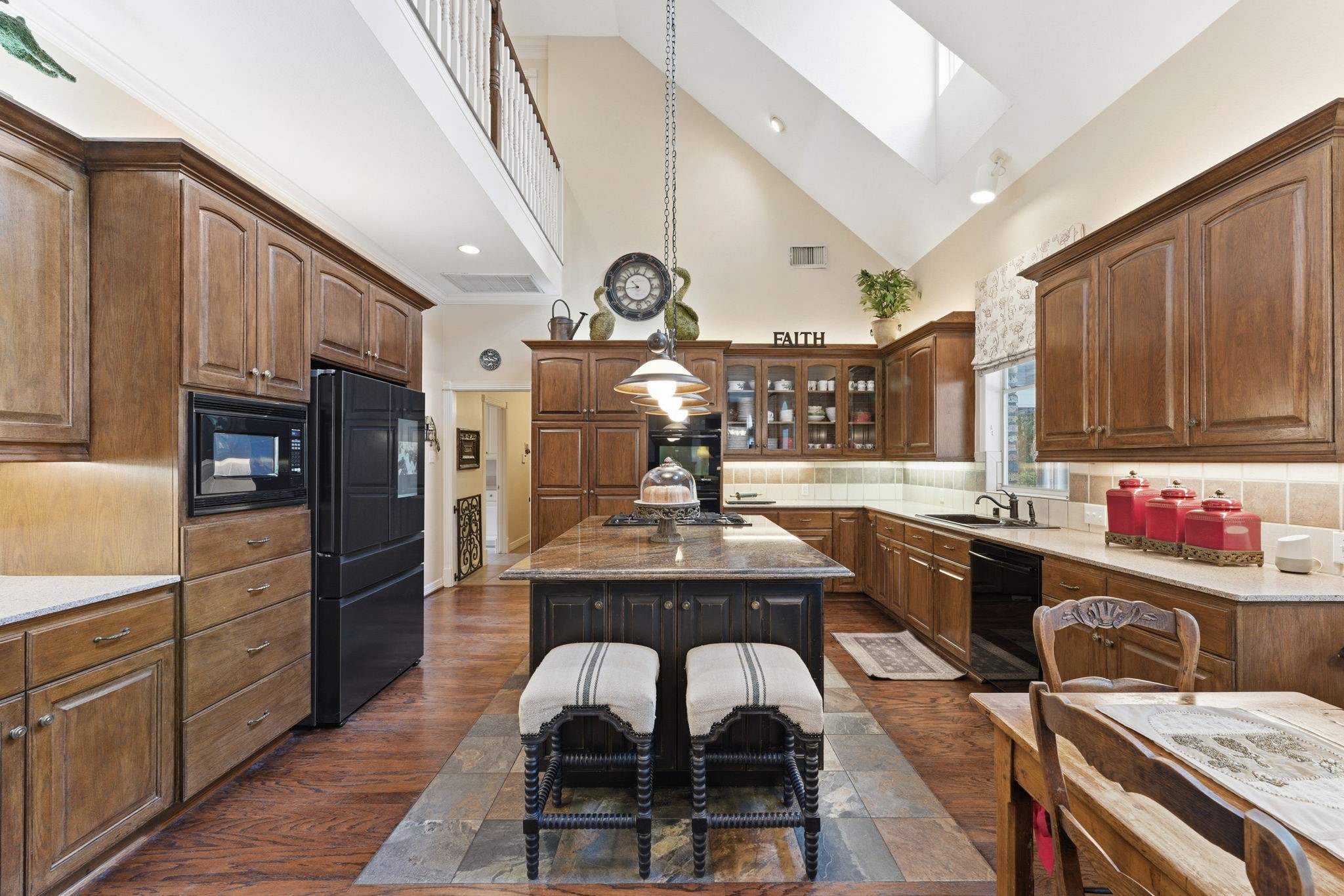 147 North Taylor Point Drive Spring, TX 77382 - Photo 17 of 44 Spacious kitchen with vaulted ceiling and balcony.