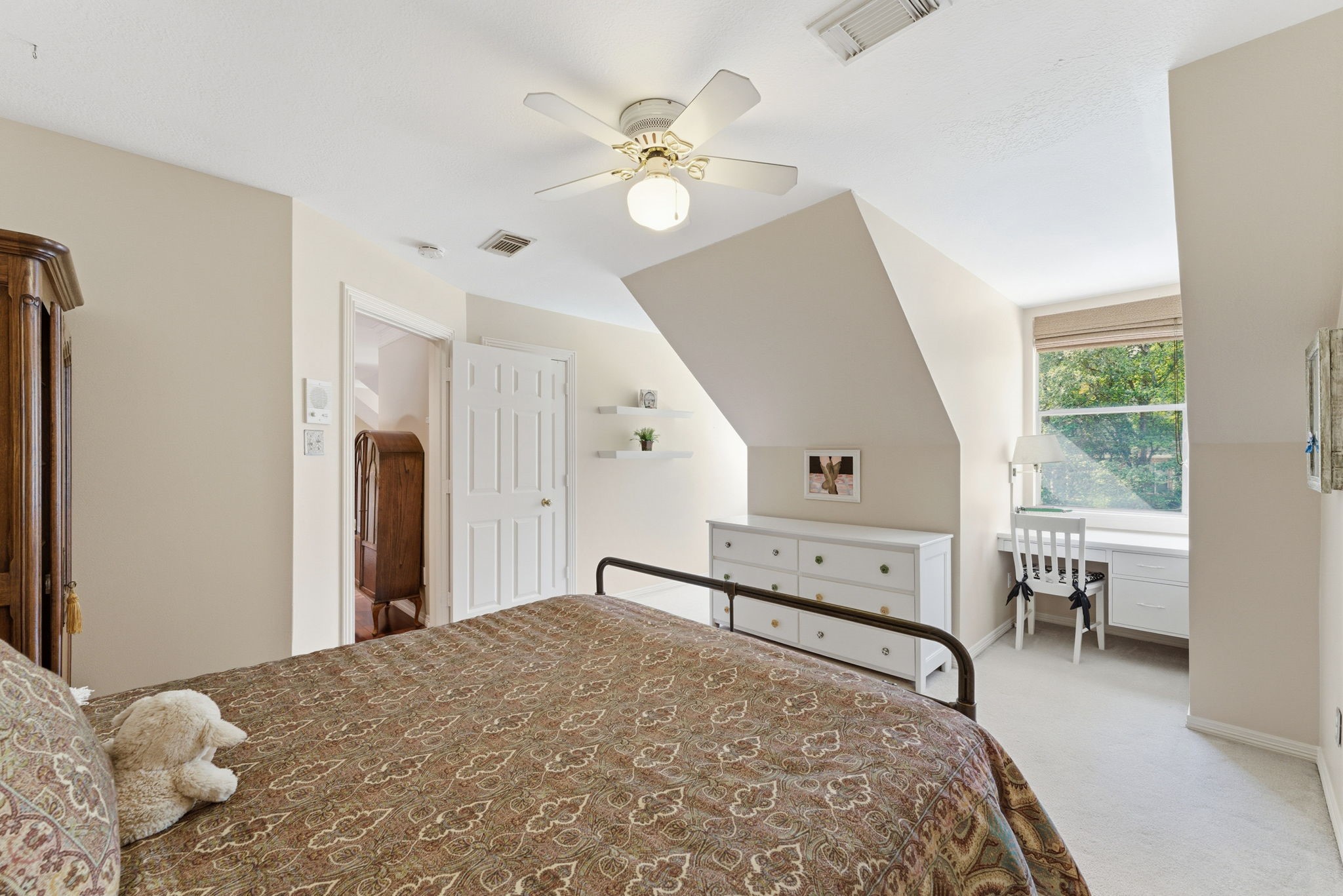 147 North Taylor Point Drive Spring, TX 77382 - Photo 30 of 44 This cozy bedroom offers a serene retreat with soft natural light, featuring a charming nook perfect for a home office or reading area.