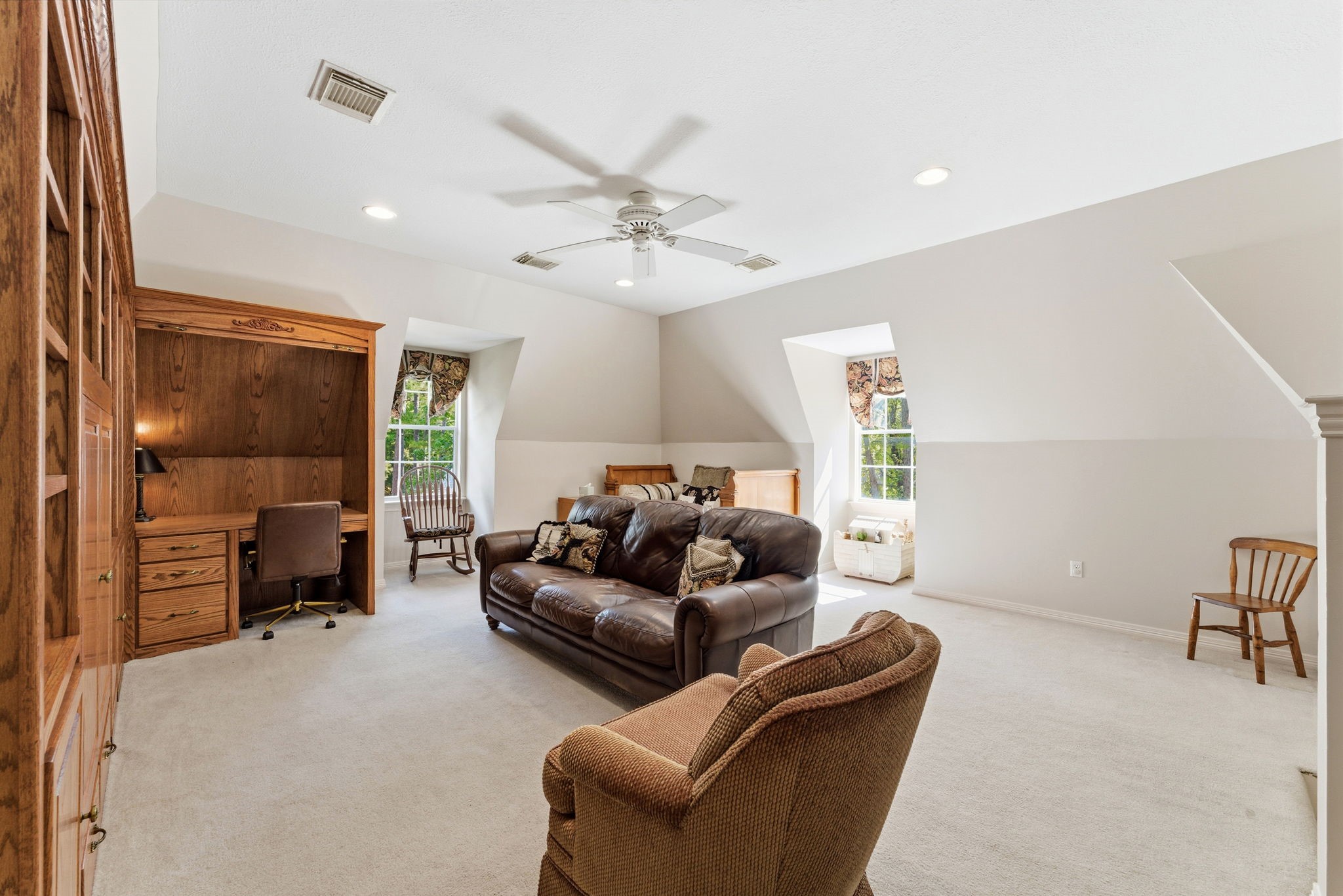 147 North Taylor Point Drive Spring, TX 77382 - Photo 35 of 44 The game room is very spacious with built in cabinetry for a TV and another desk space.