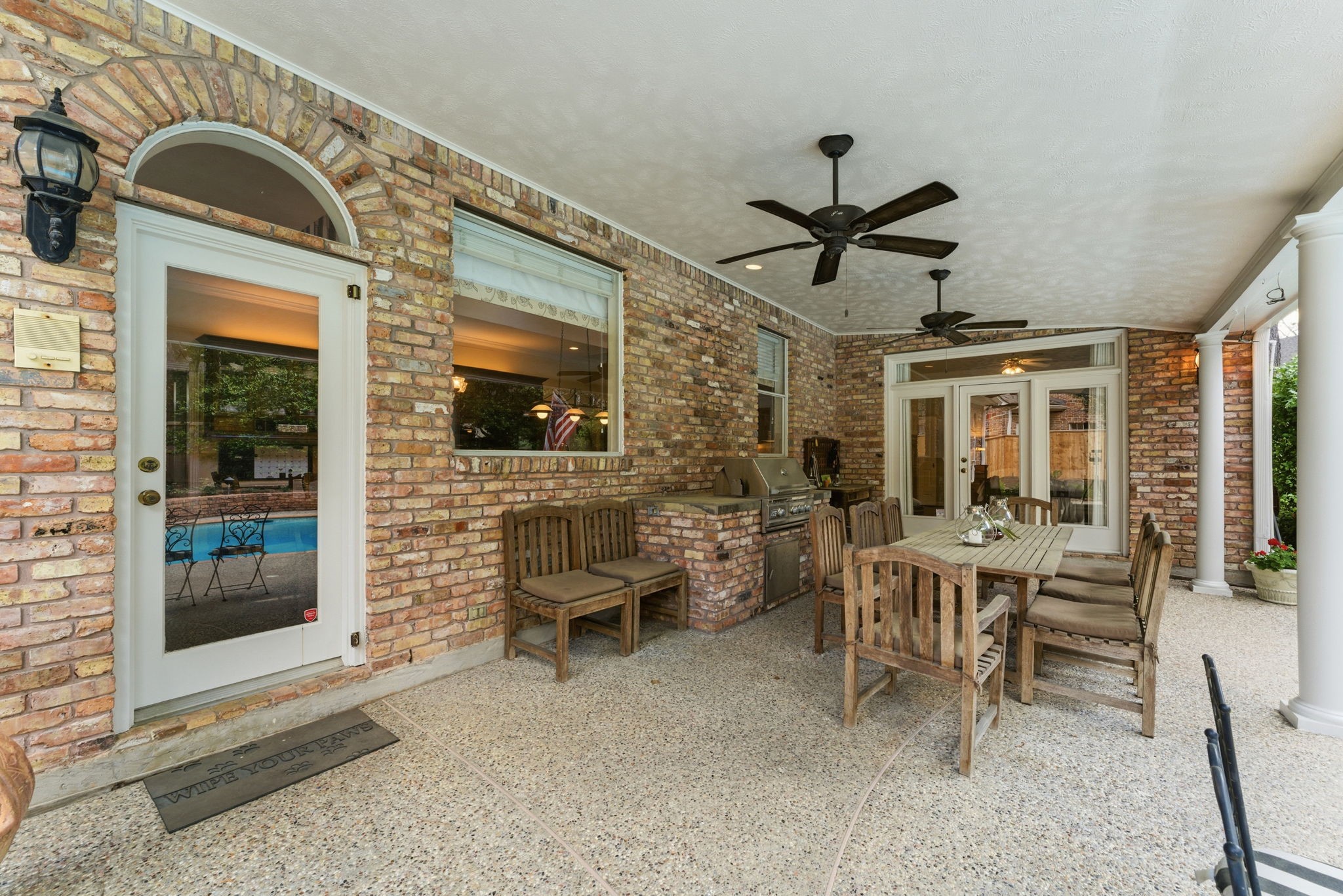 147 North Taylor Point Drive Spring, TX 77382 - Photo 37 of 44 Discover outdoor elegance with a charming covered back patio featuring a built-in grill, perfect for entertaining and relaxation.