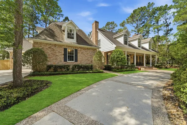 front view of a house with a garden