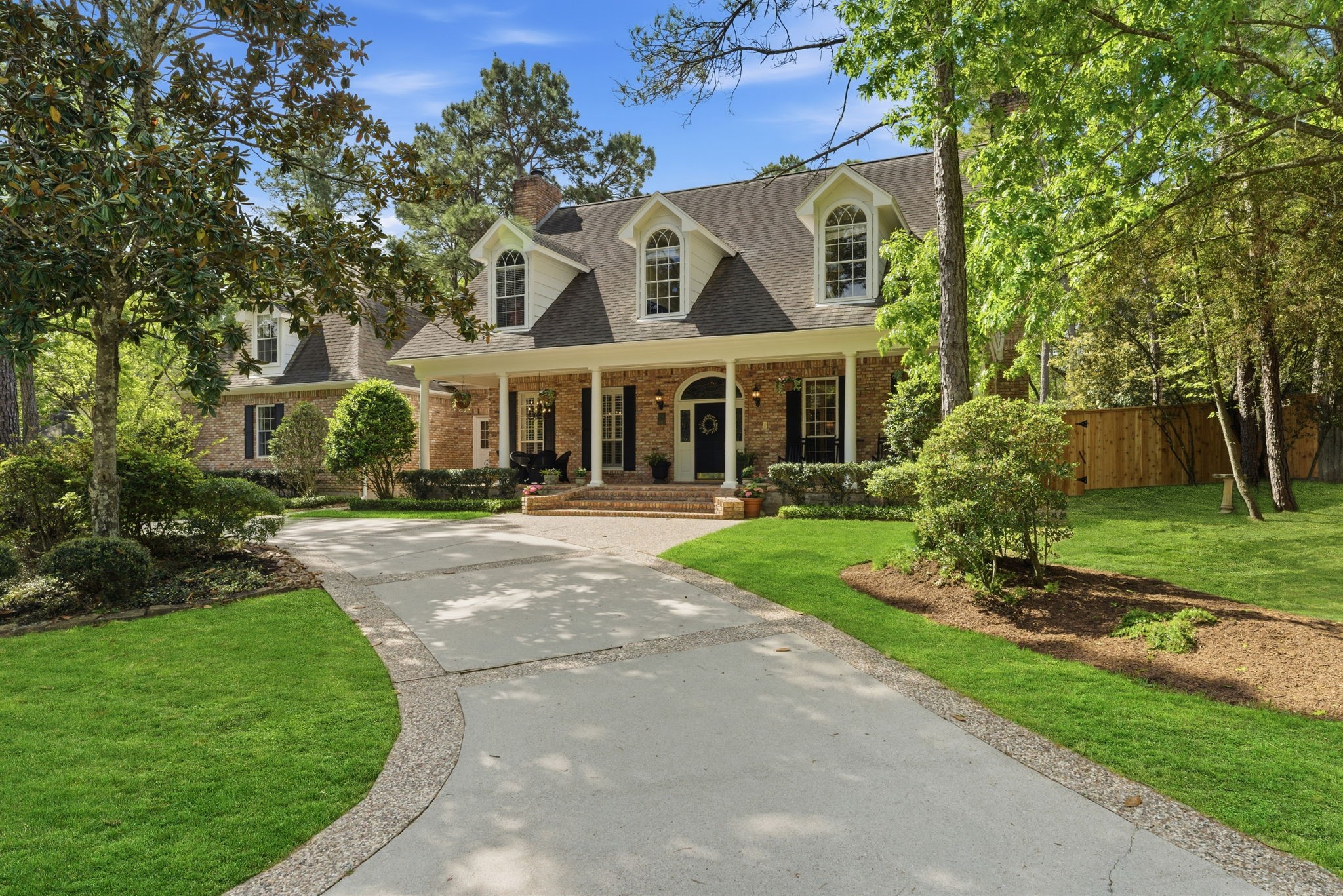 147 North Taylor Point Drive Spring, TX 77382 - Photo 42 of 44 Discover this charming home with a welcoming front-right view, featuring a spacious driveway, lush greenery, and classic architectural details that invite you to explore further.