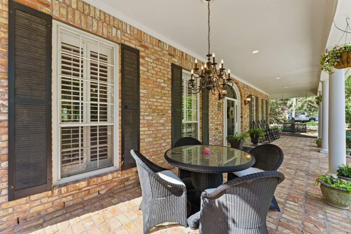 147 North Taylor Point Drive Spring, TX 77382 - Photo 5 of 44 The front porch can be used as a dining space complete with a chandelier!