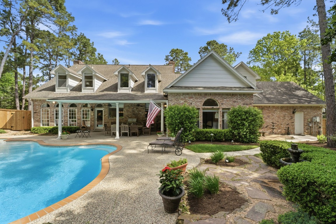 147 North Taylor Point Drive Spring, TX 77382 - Photo 7 of 44 Discover your serene oasis with this stunning home, featuring a beautifully landscaped backyard perfect for relaxation and entertaining, and a luxurious primary bedroom retreat to unwind in style.