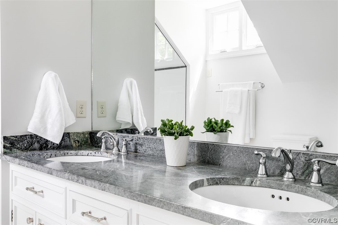 213 Culpepper Road Henrico, VA 23229 - Photo 37 of 46 a bathroom with sink and mirror