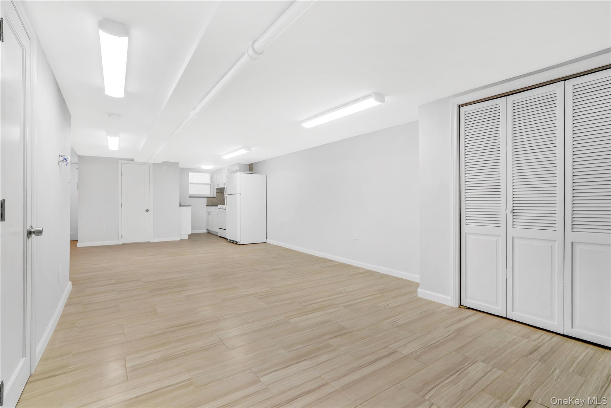 21-69 45th Street, Unit 3 Queens, NY 11105 - Photo 21 of 31 a view of empty room with wooden floor