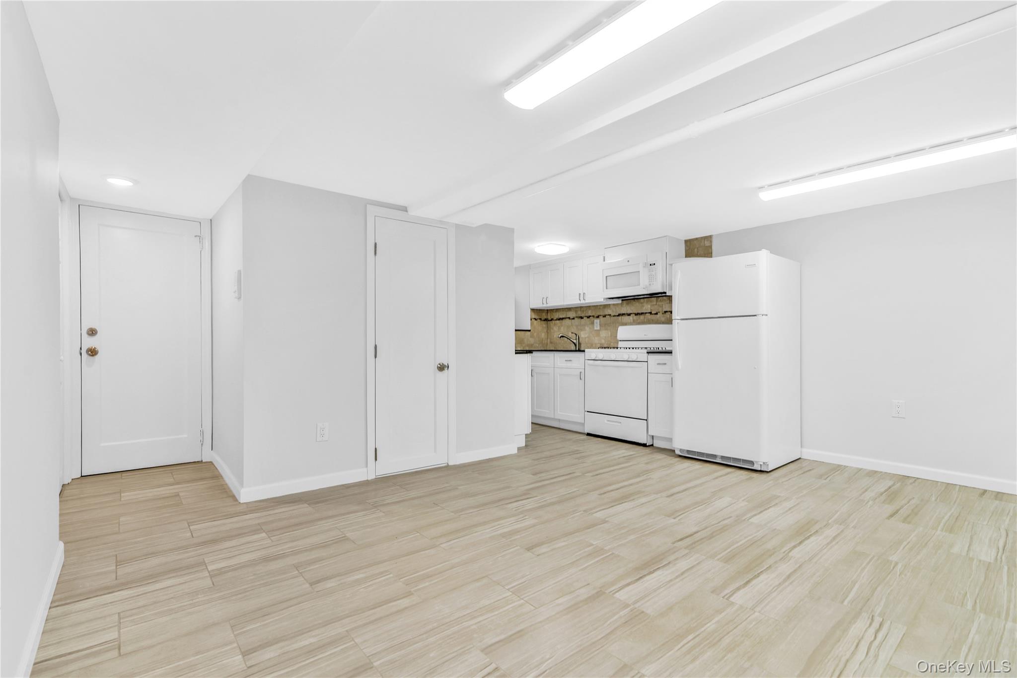 21-69 45th Street, Unit 3 Queens, NY 11105 - Photo 23 of 31 a view of a kitchen with wooden floor