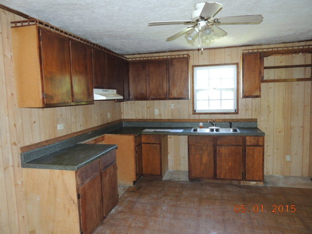 686 Tanglewood Road Fort Valley, GA 31030 - Photo 2 of 9 a kitchen with granite countertop cabinets stainless steel appliances a sink and a window
