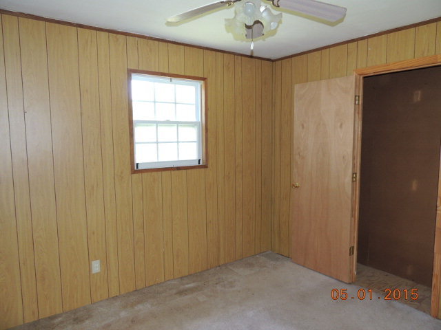 686 Tanglewood Road Fort Valley, GA 31030 - Photo 6 of 9 a view of an empty room with a window