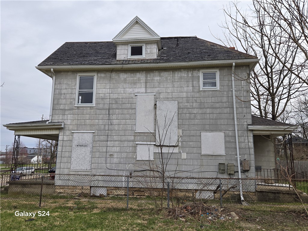 727 West High Street Springfield, OH 45506 - Photo 4 of 29 This two-story structure features traditional siding and a classic gable roof.