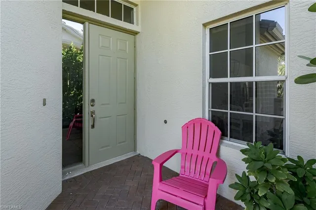 a room with furniture and a potted plant