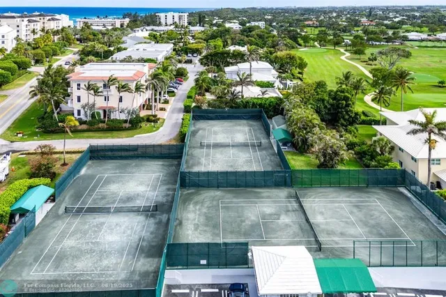 an aerial view of residential houses with outdoor space