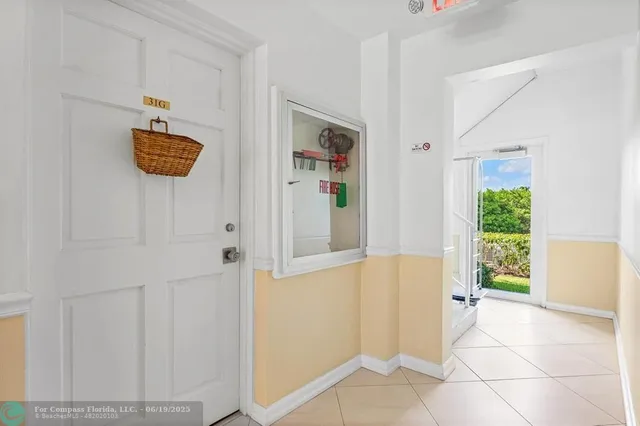 a view of a hallway with front door