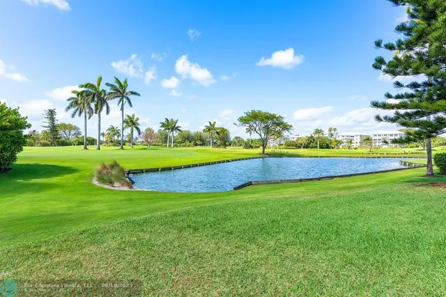 a view of a golf course with a big yard