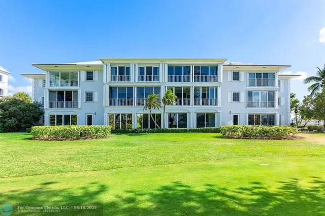 a front view of building with yard