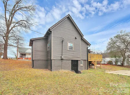 a view of a house with snow on the road