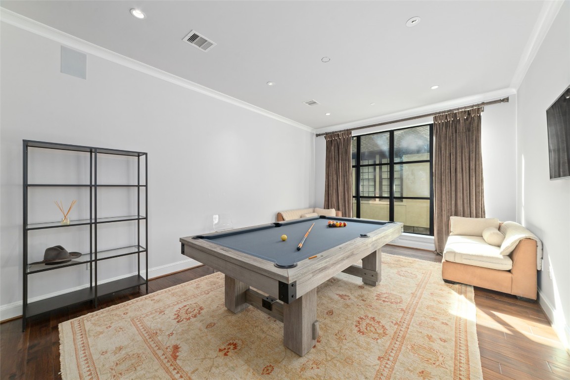 2221 Welch Street, Unit 201 Houston, TX 77019 - Photo 12 of 49 a living room with a couch and a table