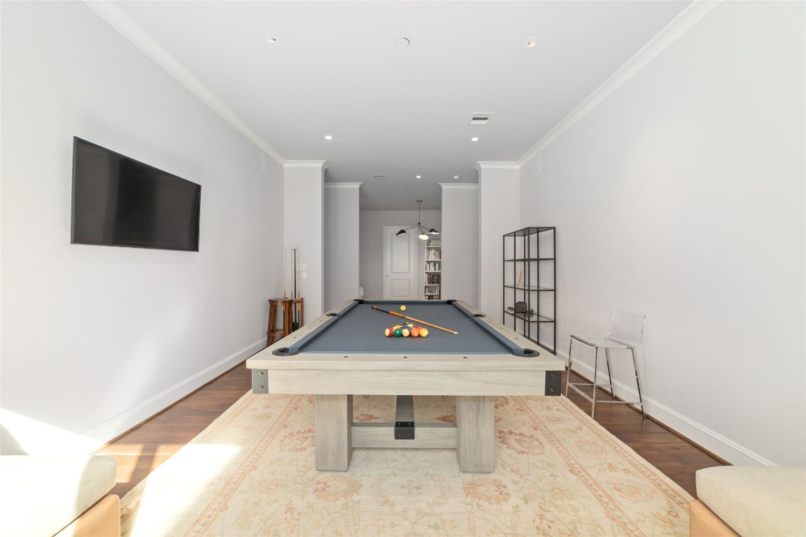2221 Welch Street, Unit 201 Houston, TX 77019 - Photo 13 of 49 a living room with furniture pool table and a flat screen tv