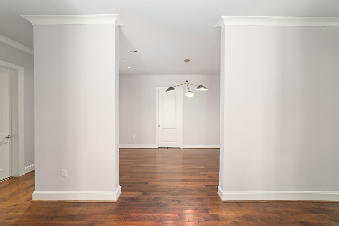 2221 Welch Street, Unit 201 Houston, TX 77019 - Photo 14 of 49 a view of a hallway with wooden floor