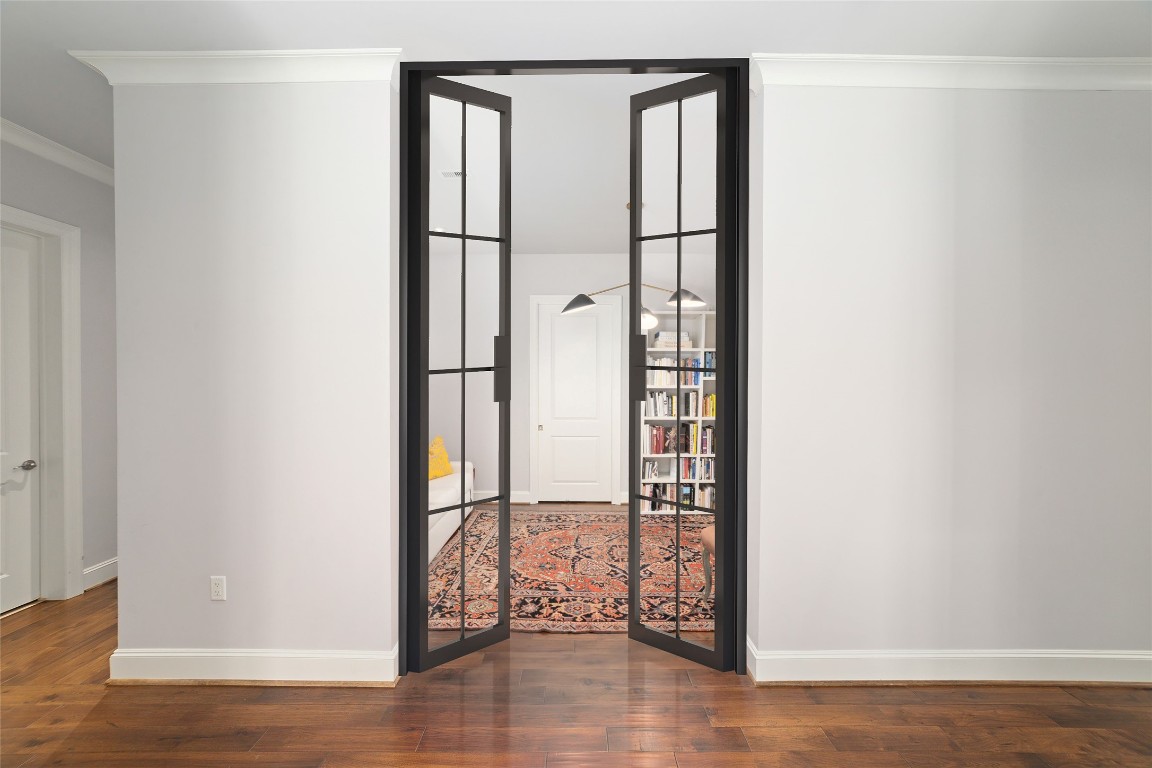 2221 Welch Street, Unit 201 Houston, TX 77019 - Photo 16 of 49 Let's take you inside this spacious home office. Virtually Staged with wrought-iron doors.
