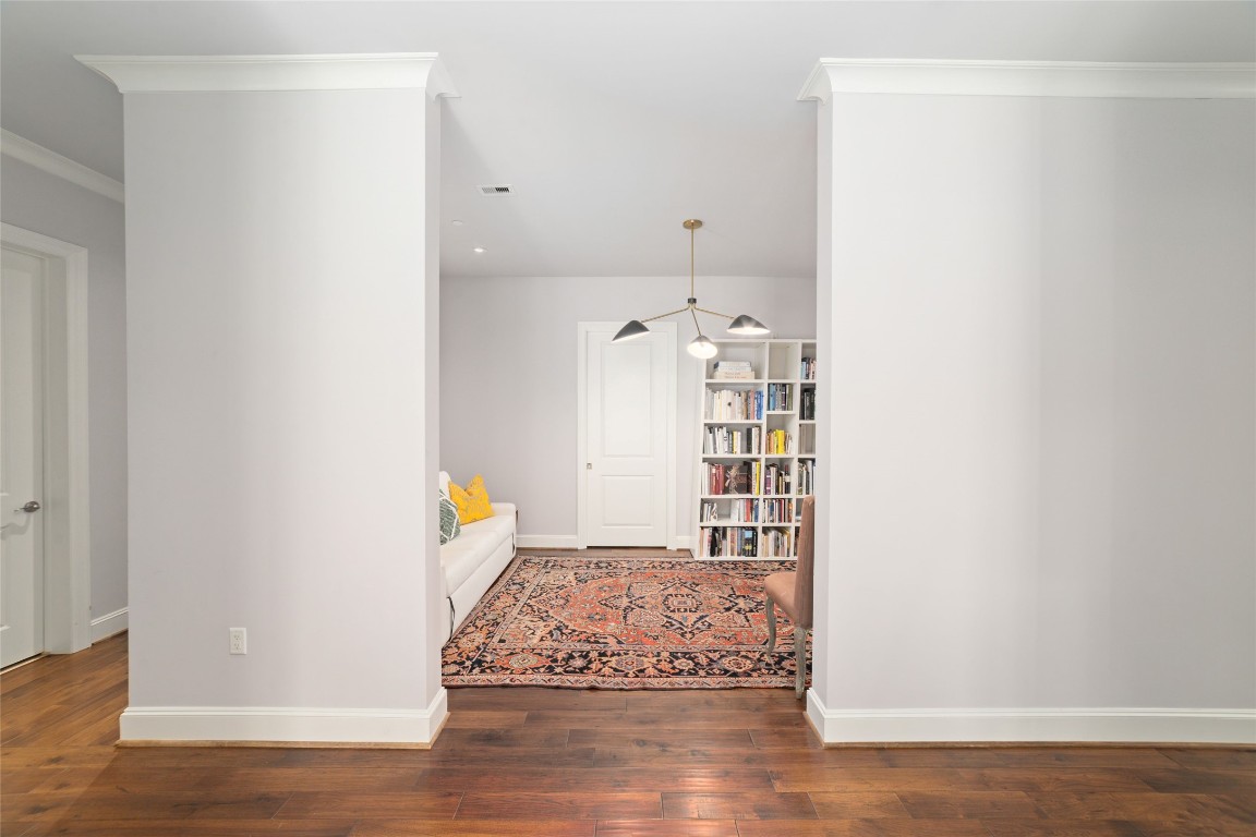 2221 Welch Street, Unit 201 Houston, TX 77019 - Photo 17 of 49 Modern, premium light fixtures draw your eye to this versatile space, perfect for a home office, gym, additional bedroom, or whatever may suit your needs.