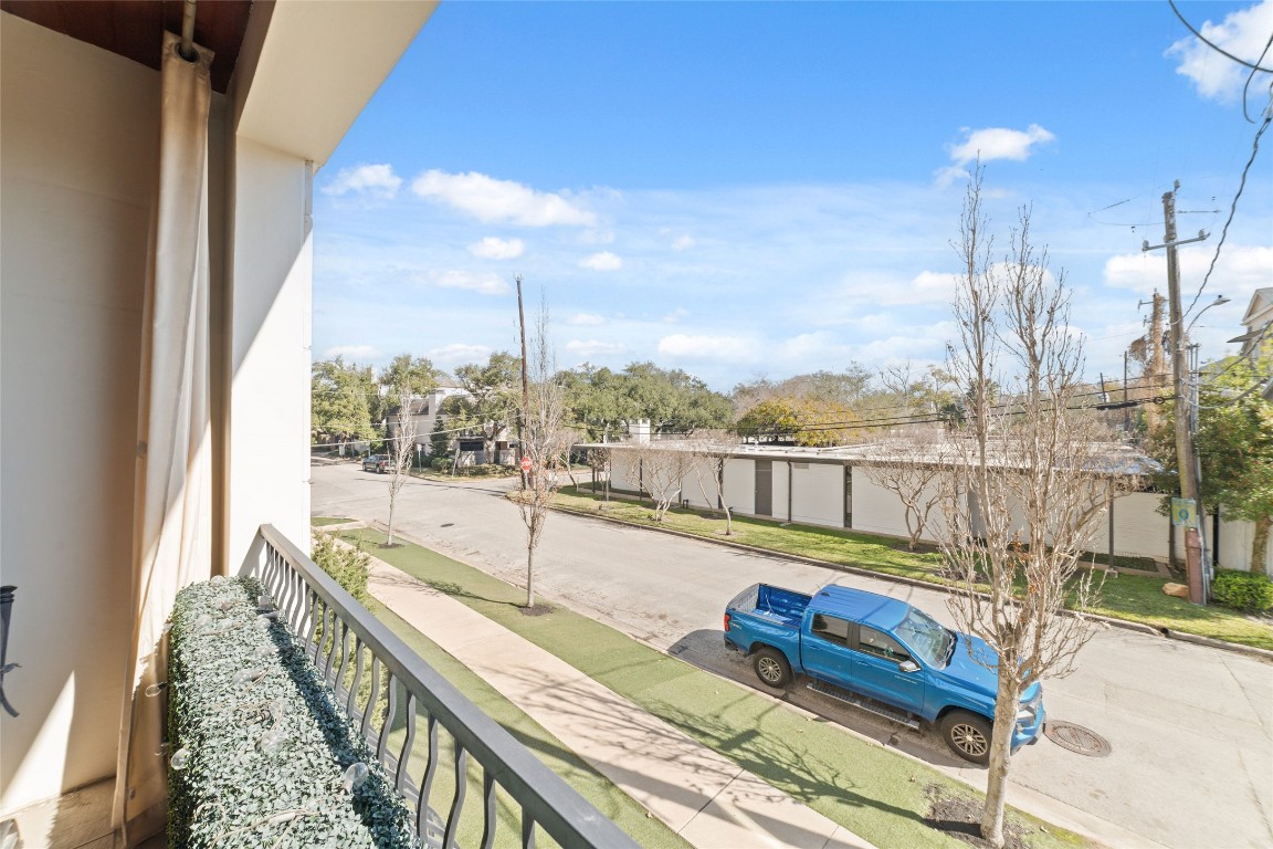 2221 Welch Street, Unit 201 Houston, TX 77019 - Photo 33 of 49 A view from the main terrace overlooking the sidewalk-lined Spann St.