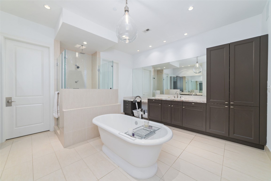2221 Welch Street, Unit 201 Houston, TX 77019 - Photo 37 of 49 a bathroom with a sink a toilet and shower