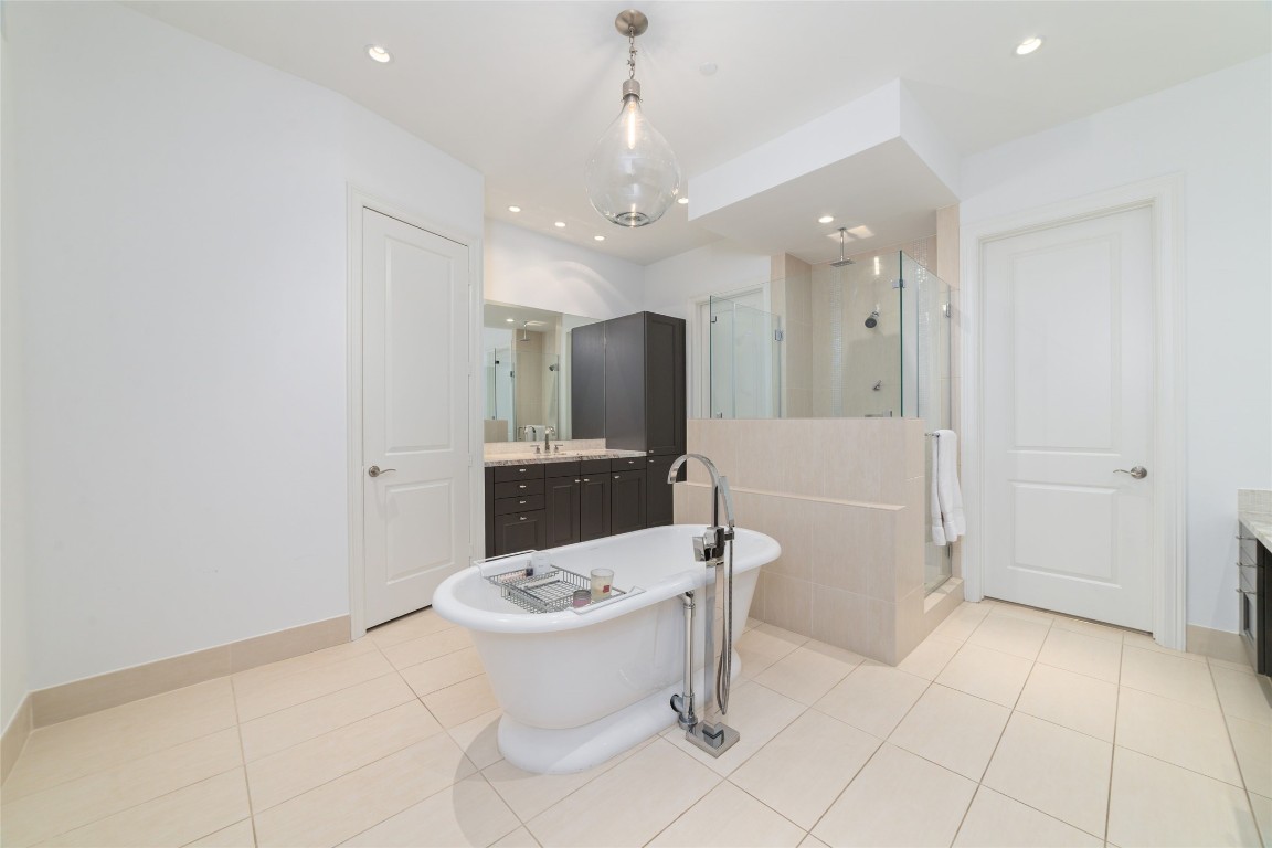 2221 Welch Street, Unit 201 Houston, TX 77019 - Photo 38 of 49 a bathroom with a sink toilet and shower