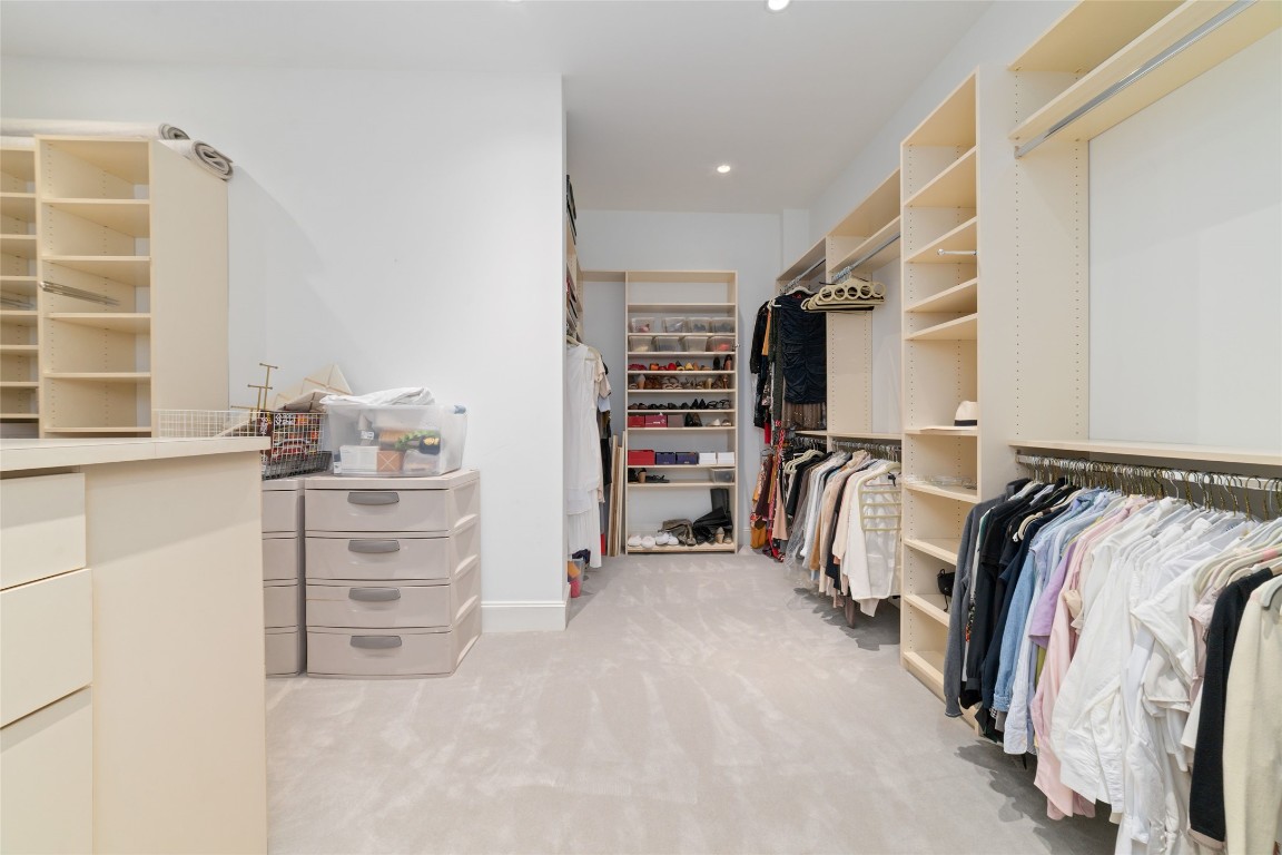 2221 Welch Street, Unit 201 Houston, TX 77019 - Photo 40 of 49 a view of walk in closet with clothes and shoes