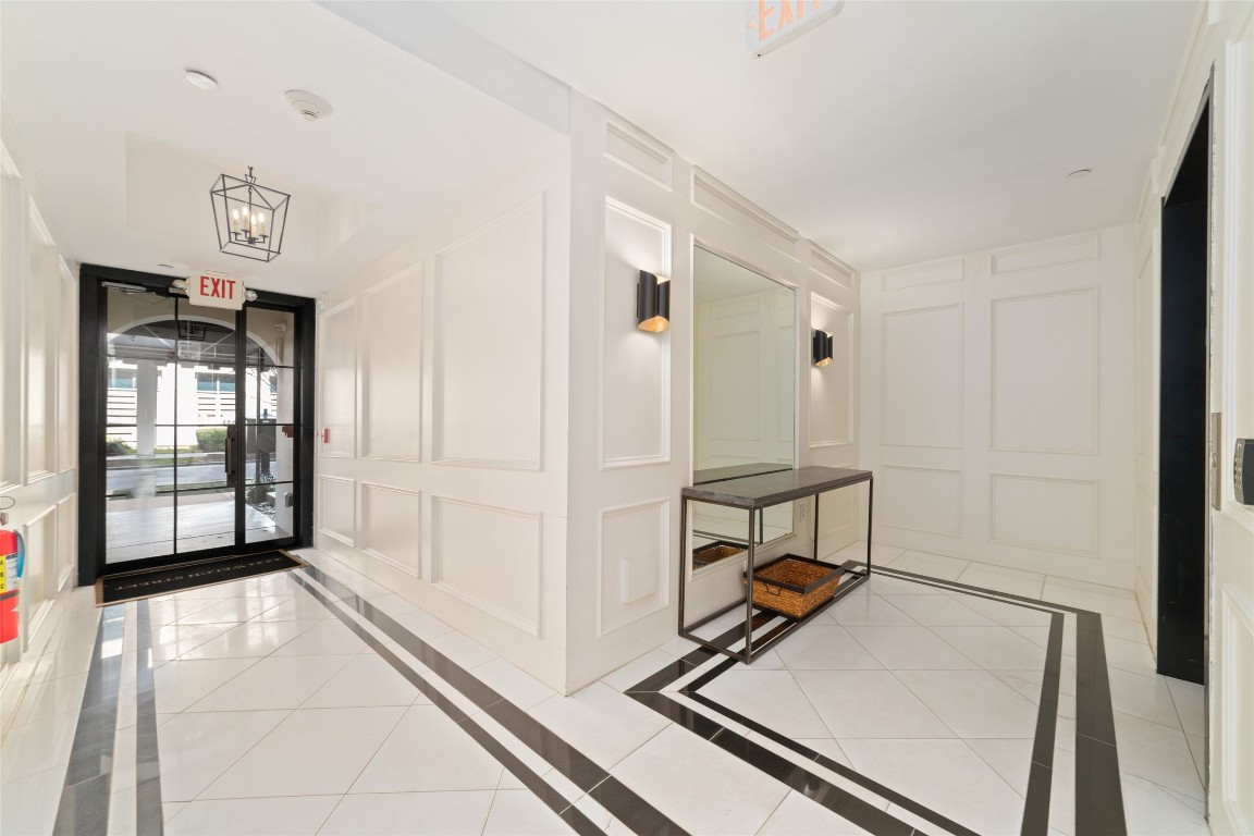 2221 Welch Street, Unit 201 Houston, TX 77019 - Photo 42 of 49 Entering the posh and elegant entryway through the main entrance, you'll find easy access to the elevator (pictured on right).
