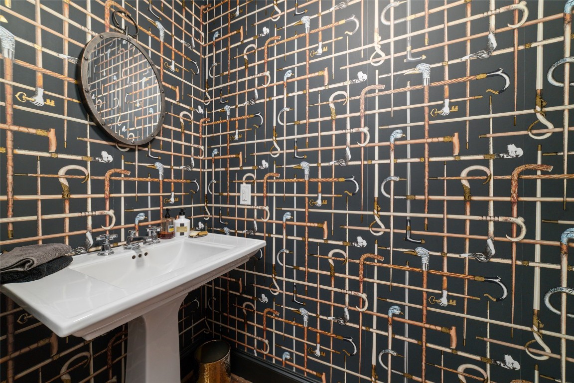 2221 Welch Street, Unit 201 Houston, TX 77019 - Photo 7 of 49 a bathroom with a sink and a mirror