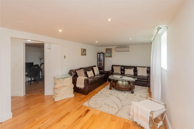 a spacious bedroom with a bed and a couch