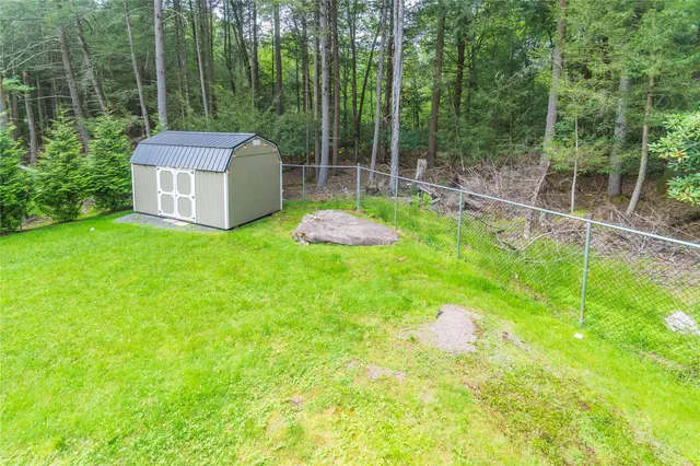 a backyard of a house with portable swimming pool and outdoor seating