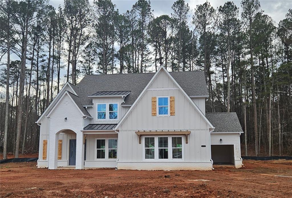 6565 Rhett Run Cumming, GA 30028 - Photo 1 of 1 a view of a white house with a large tree