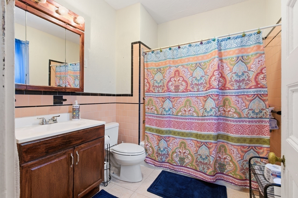 35 Algonquin Street Boston, MA 02124 - Photo 19 of 32 a bathroom with a sink a vanity and a toilet