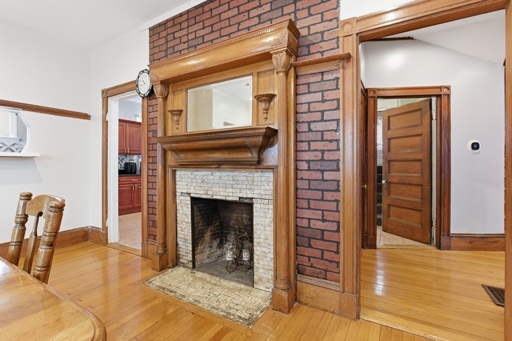 35 Algonquin Street Boston, MA 02124 - Photo 26 of 32 a view of living room with furniture and a fireplace