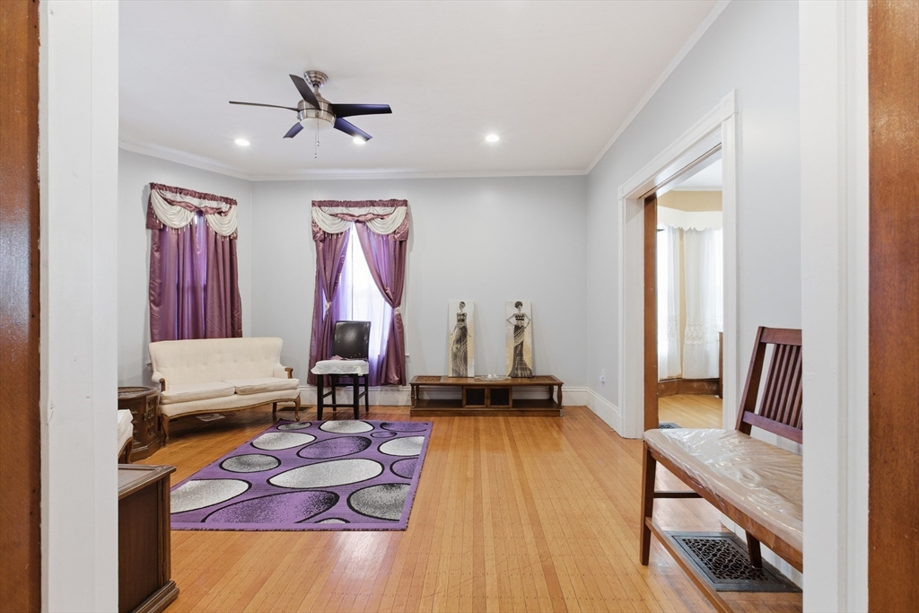 35 Algonquin Street Boston, MA 02124 - Photo 8 of 32 a living room with furniture and wooden floor