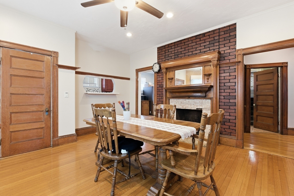 35 Algonquin Street Boston, MA 02124 - Photo 9 of 32 a view of a dining room with furniture and a fireplace