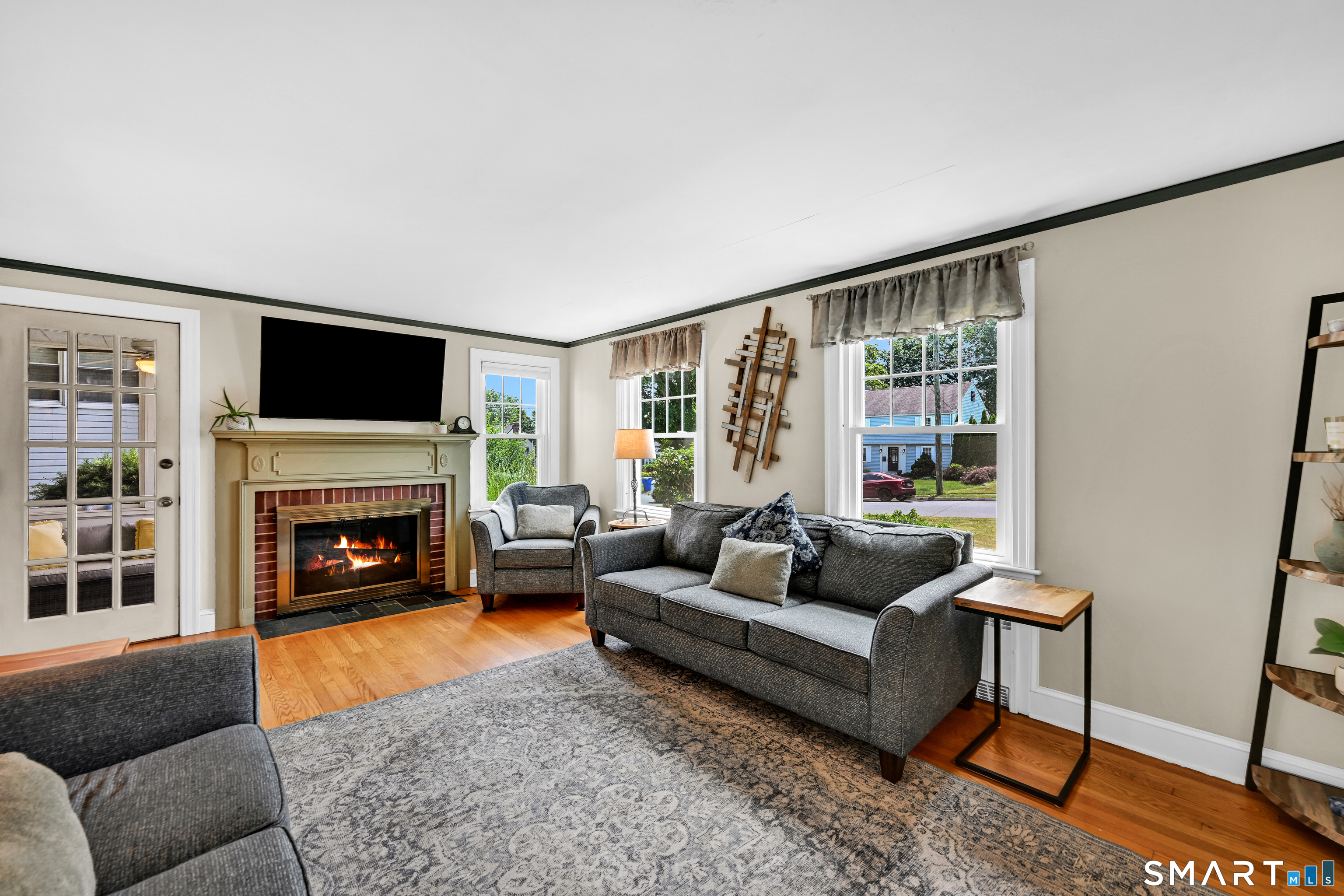 219 Clearfield Road Wethersfield, CT 06109 - Photo 5 of 37 Spacious living room with wood burning fireplace