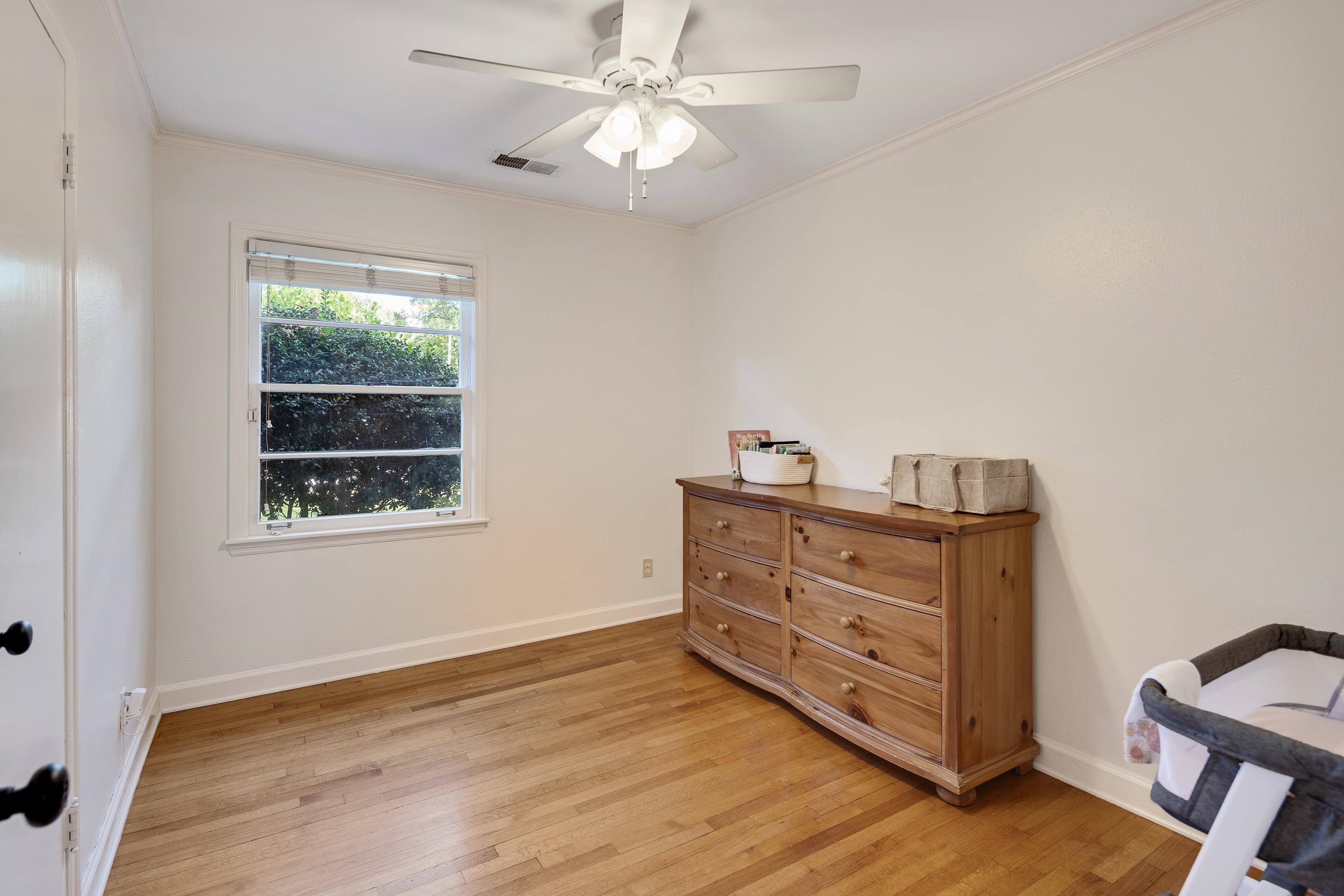 1269 West Perkins Road Memphis, TN 38117 - Photo 19 of 31 a room with a dresser and a window