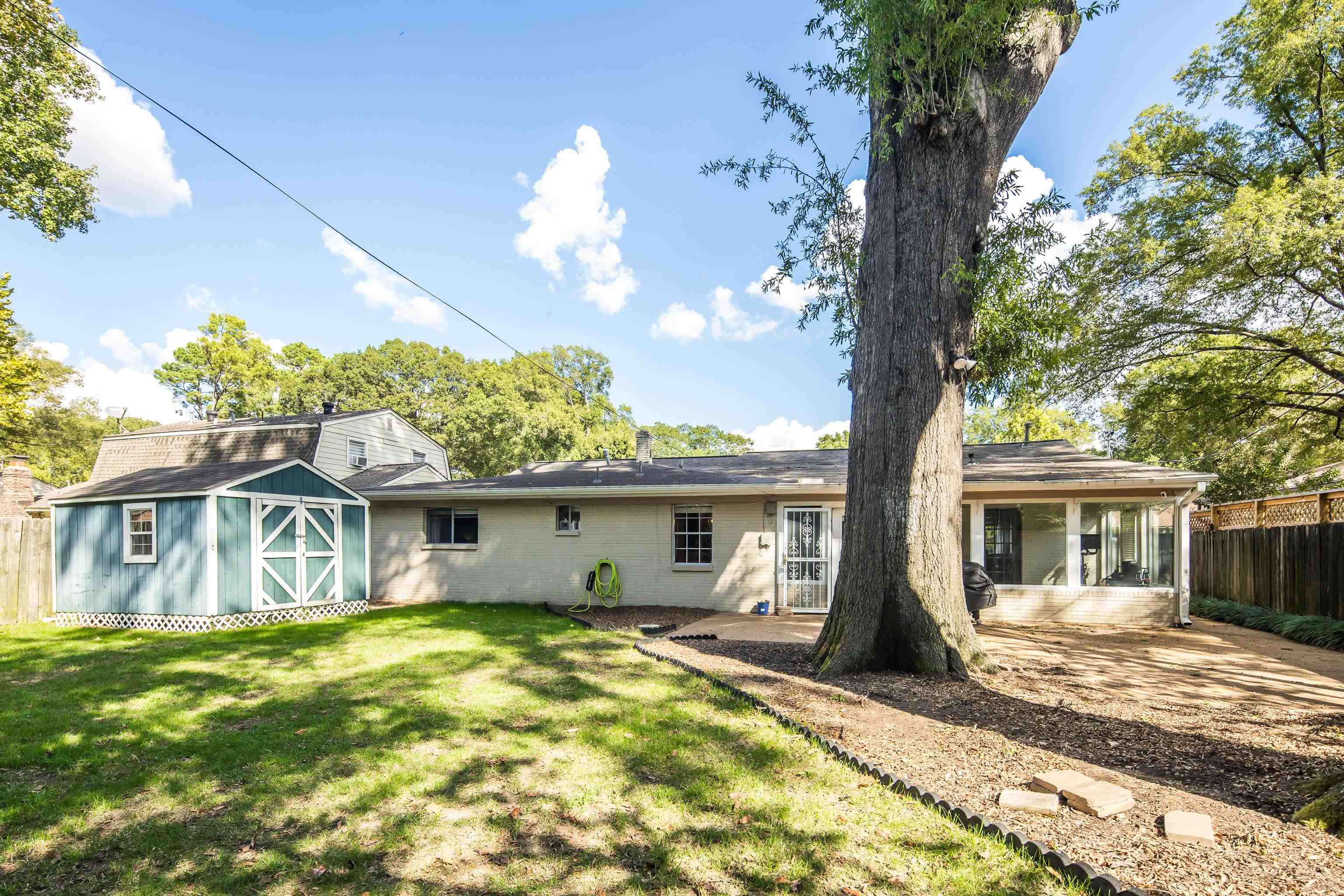 1269 West Perkins Road Memphis, TN 38117 - Photo 29 of 31 a view of a house with a backyard