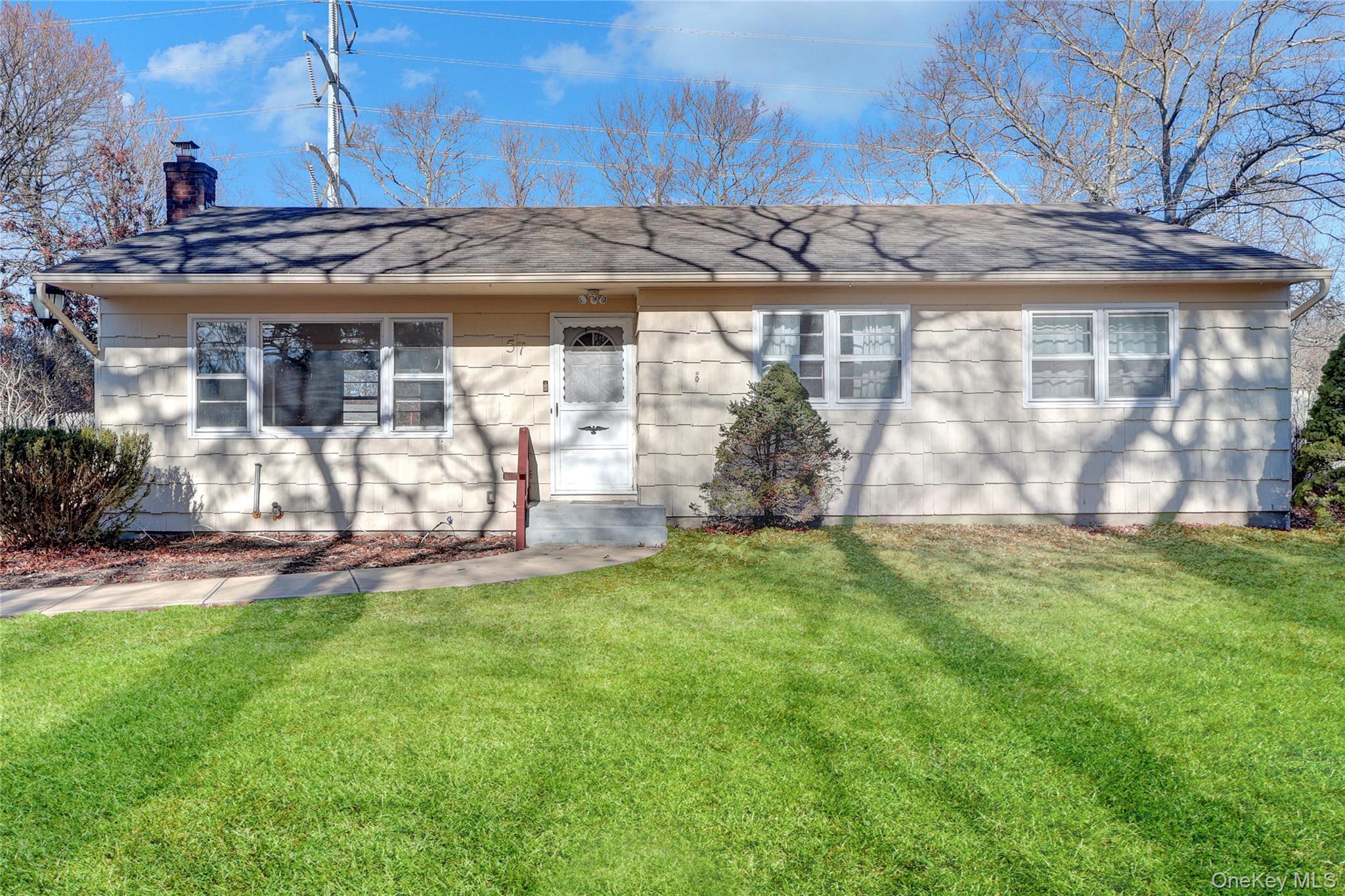 57 Middle Island Road Medford, NY 11763 - Photo 1 of 28 a view of a house with backyard and sitting area