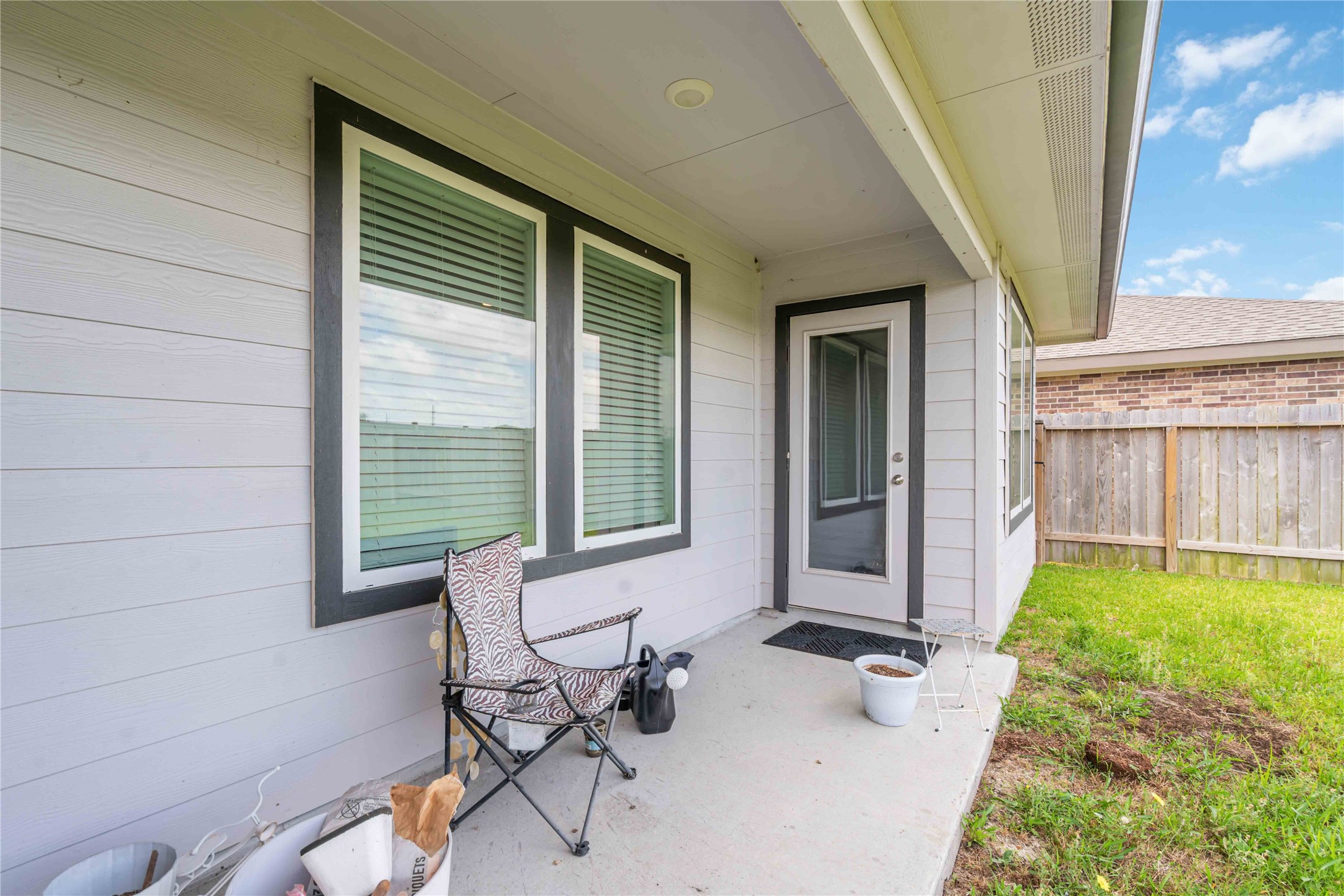7730 Robert Rosharon, TX 77583 - Photo 16 of 18 Large covered patio and privacy fencing — ideal for outdoor dining, play, or relaxing evenings.