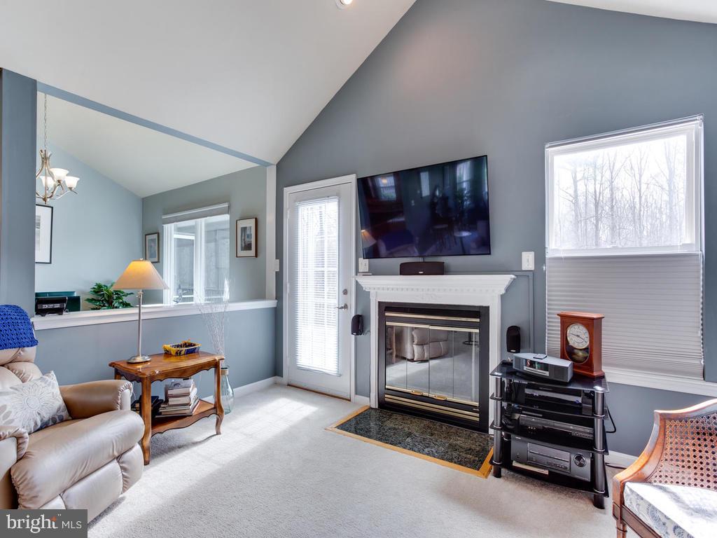 4912 Old Willows Road Chesapeake Beach, MD 20732 - Photo 3 of 56 Bright and sunny living room with wood burning FP