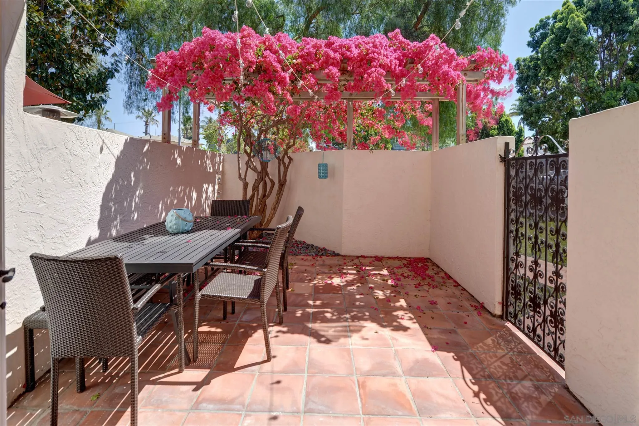 554 E Coronado, CA 92118 - Photo 12 of 13 a backyard of a house with table and chairs