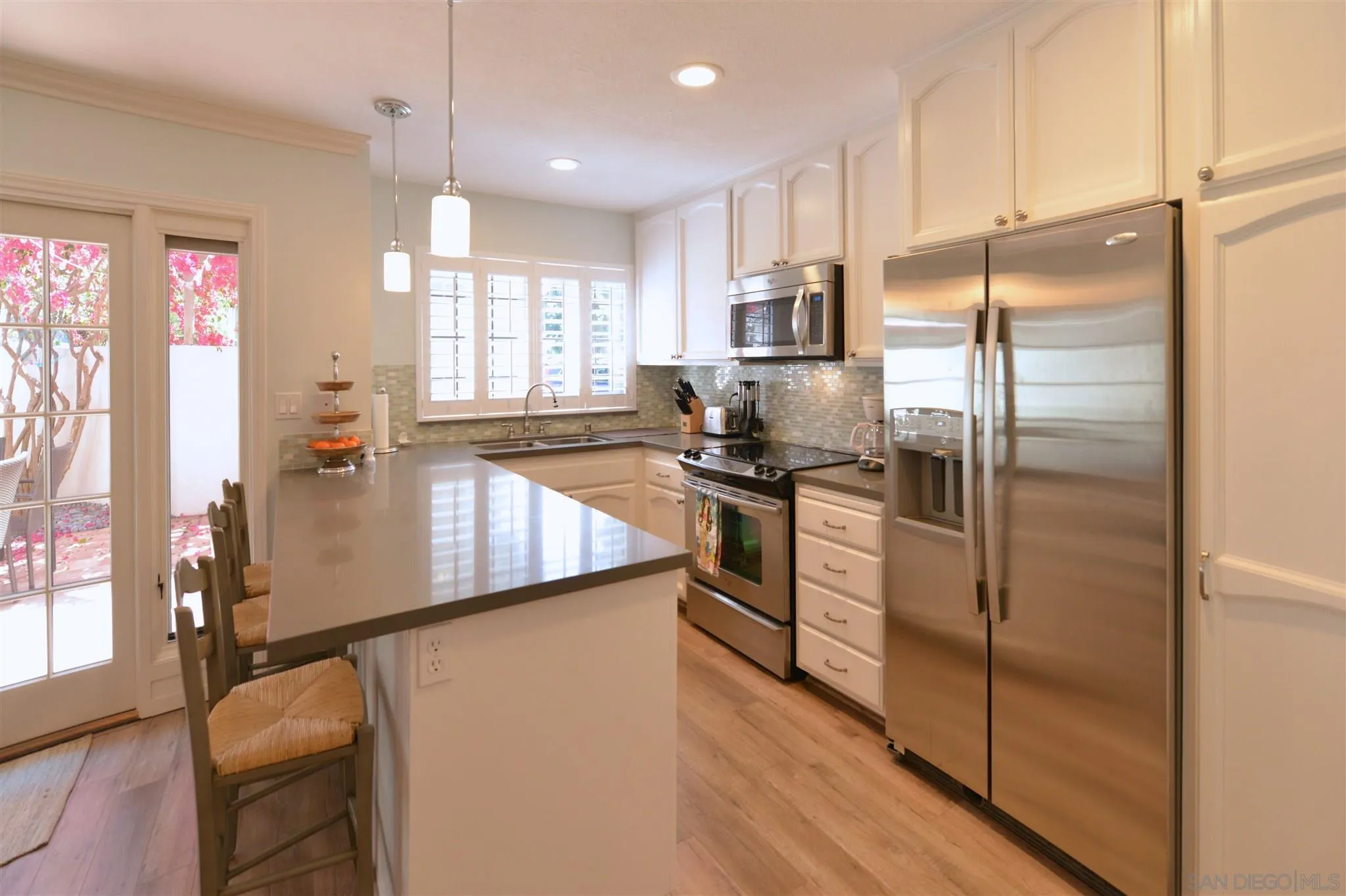 554 E Coronado, CA 92118 - Photo 3 of 13 a kitchen with stainless steel appliances granite countertop a refrigerator a stove and a sink