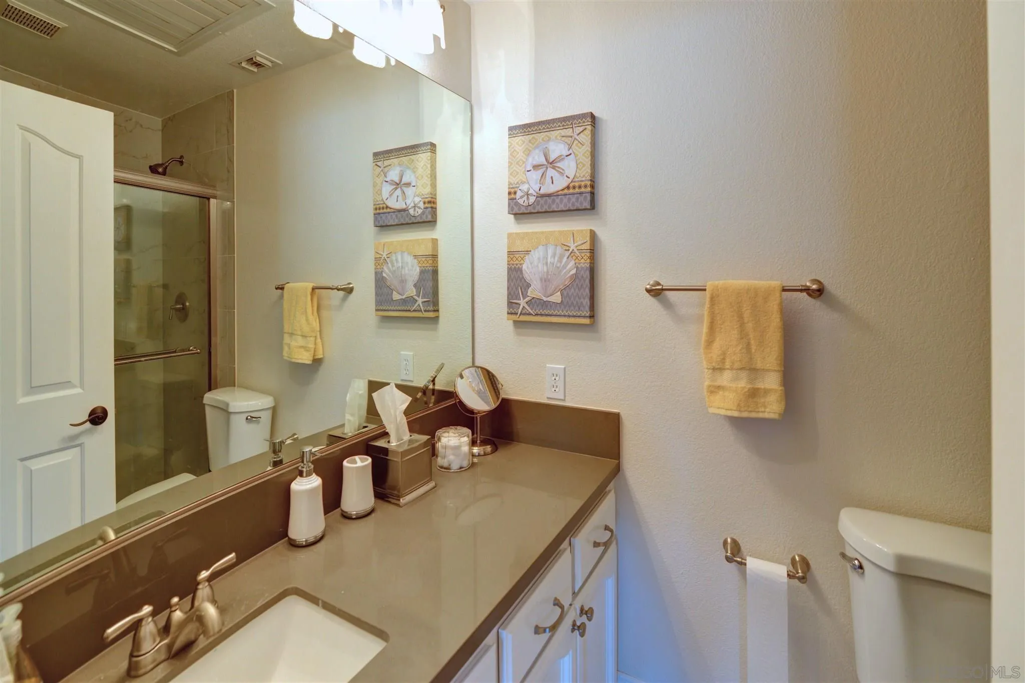 554 E Coronado, CA 92118 - Photo 7 of 13 a bathroom with a sink vanity and a mirror