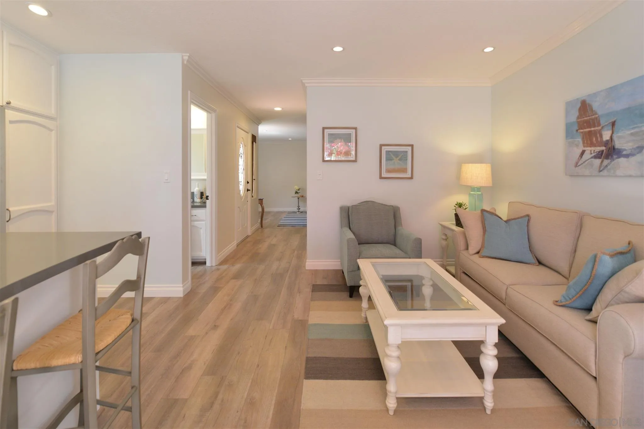 554 E Coronado, CA 92118 - Photo 9 of 13 a living room with furniture and a wooden floor