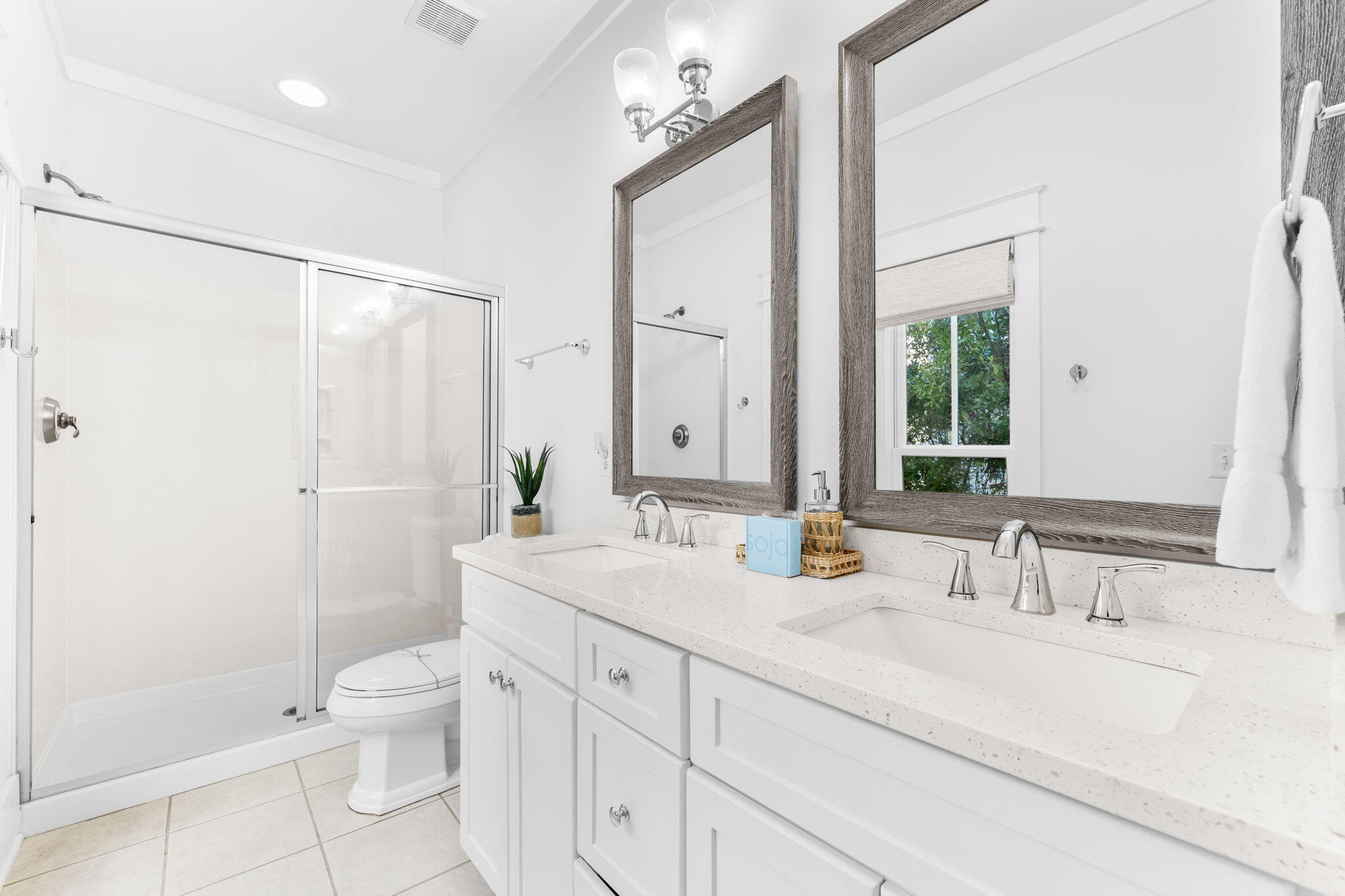 30 Chelsea Loop Road Santa Rosa Beach, FL 32459 - Photo 20 of 67 a bathroom with a double vanity sink toilet mirror and shower