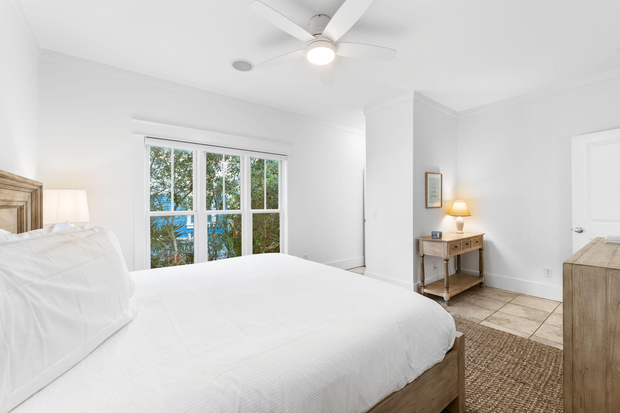 30 Chelsea Loop Road Santa Rosa Beach, FL 32459 - Photo 32 of 67 a bedroom with a large bed and a chandelier fan